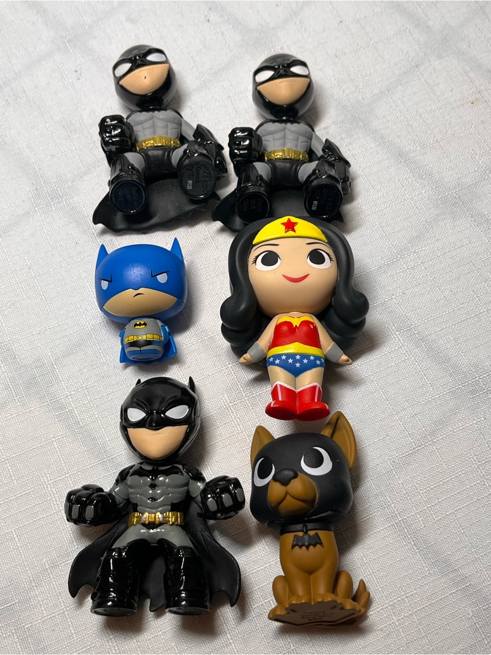 Collection of DC Comics superhero toys or cake toppers